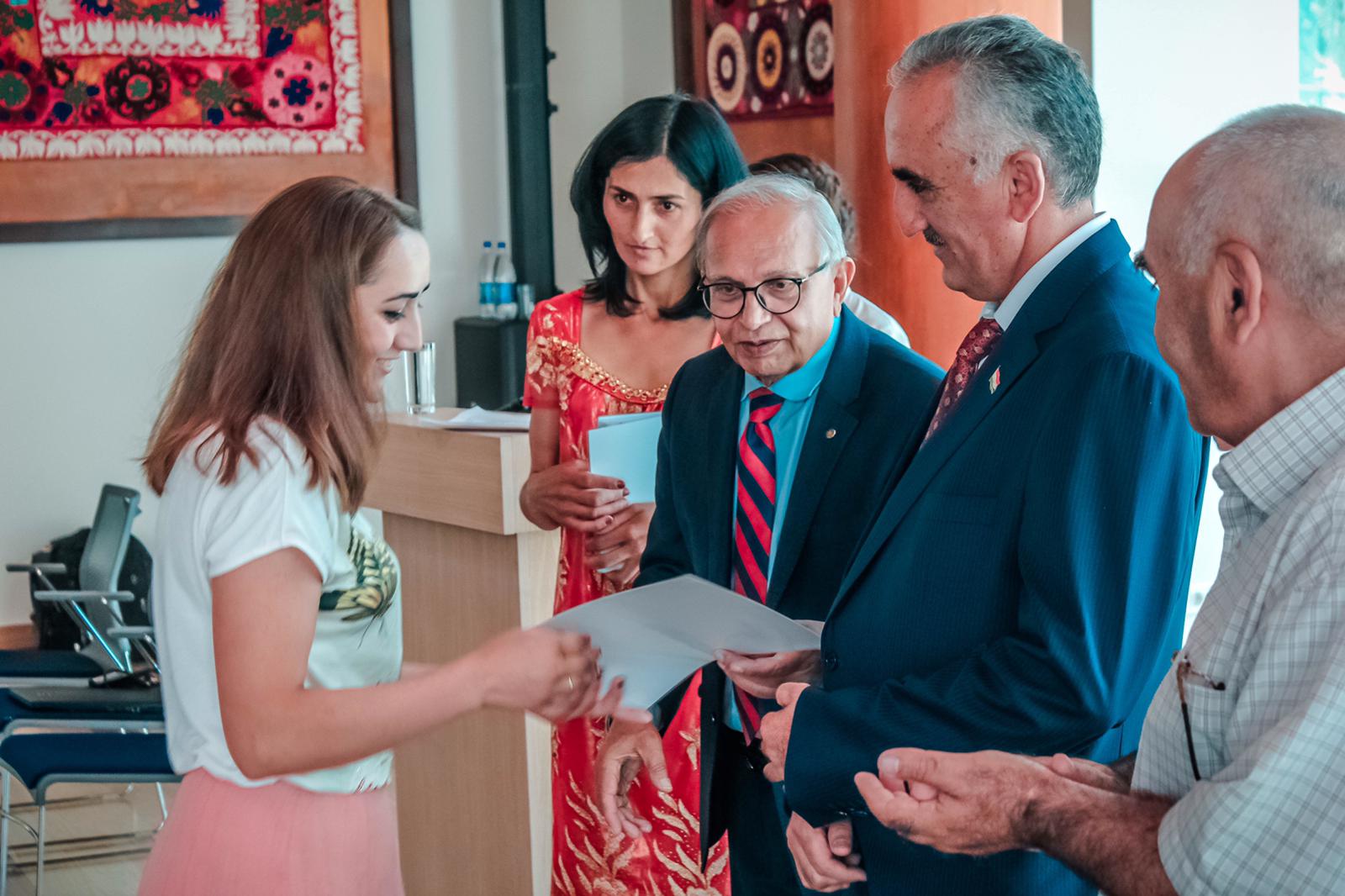 Head of GBAO govong certificate to a benificiary